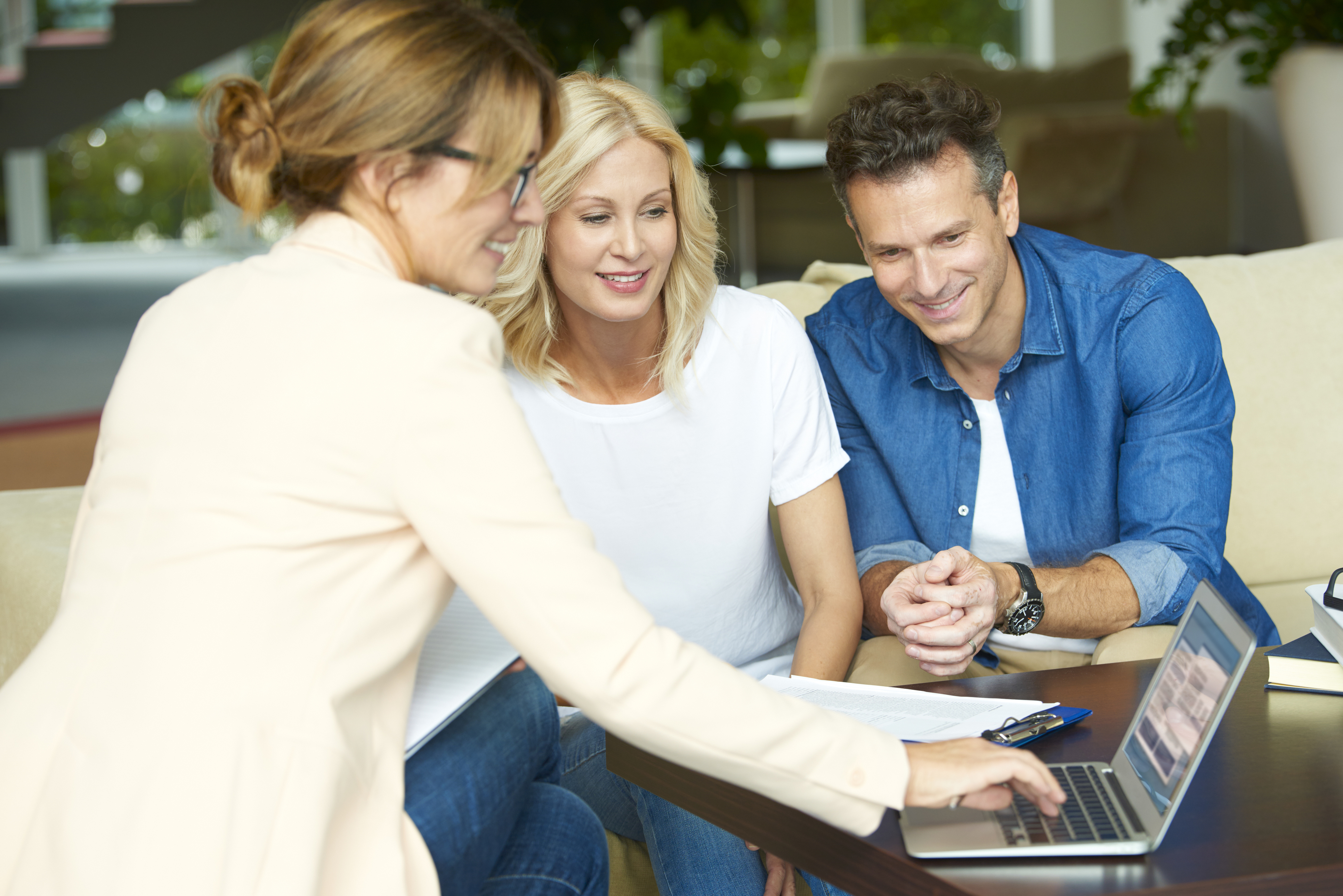 Shot of a middle aged couple consulting with their investment advisor their retirement savings plan.