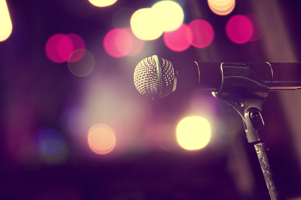 Live music background.Microphone and stage lights