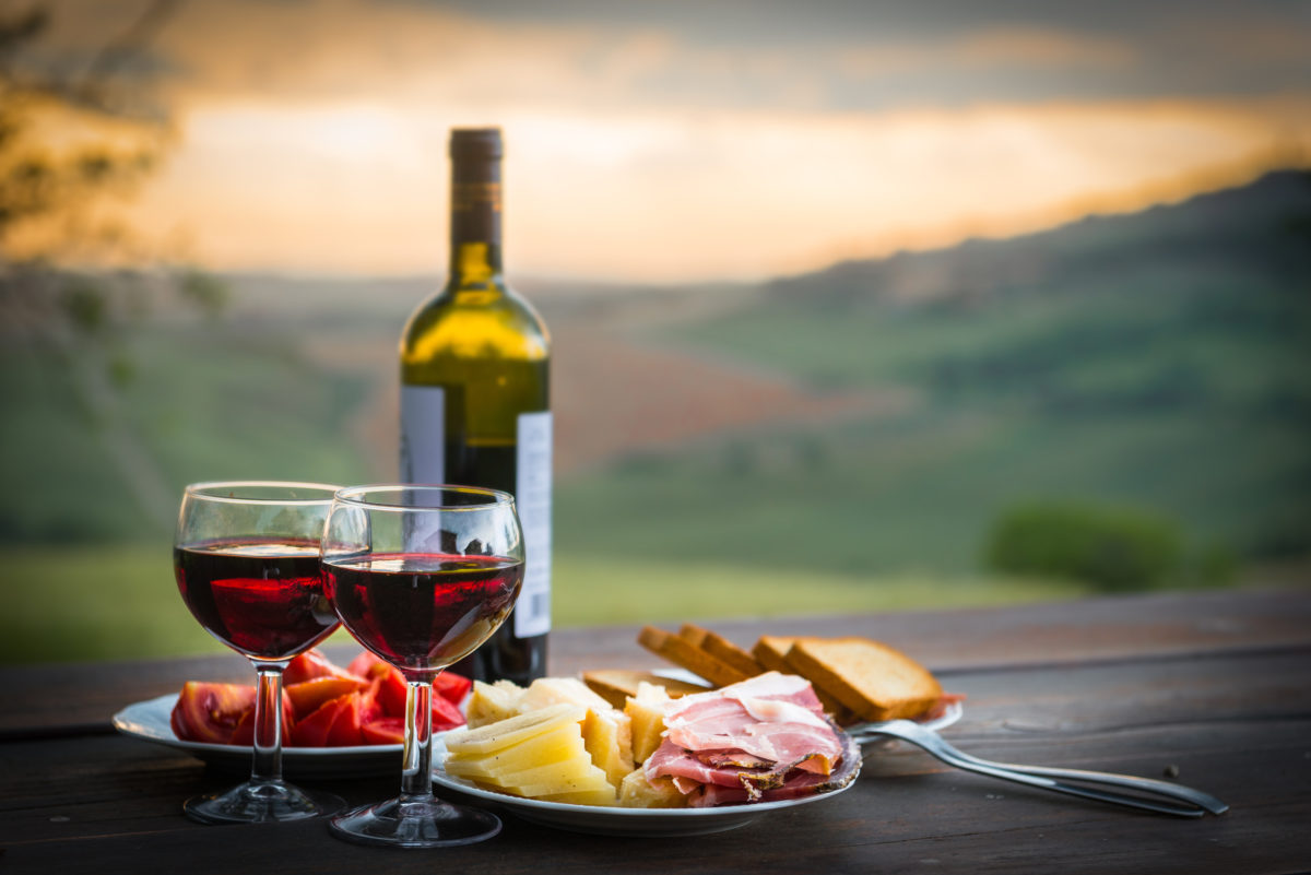 still life Red wine ,cheese and prosciutto. Romantic dinner outdoors