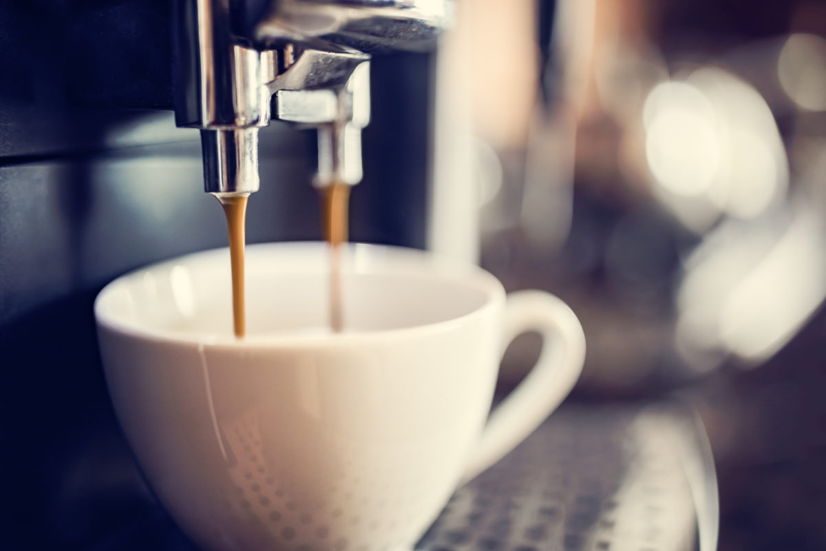 Espresso machine making fresh cup of coffee