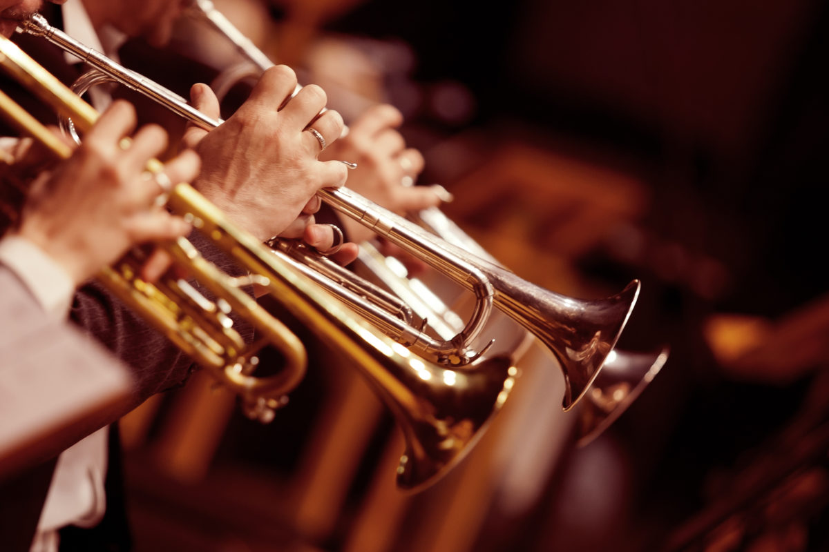 Hands trumpeters in the orchestra closeup