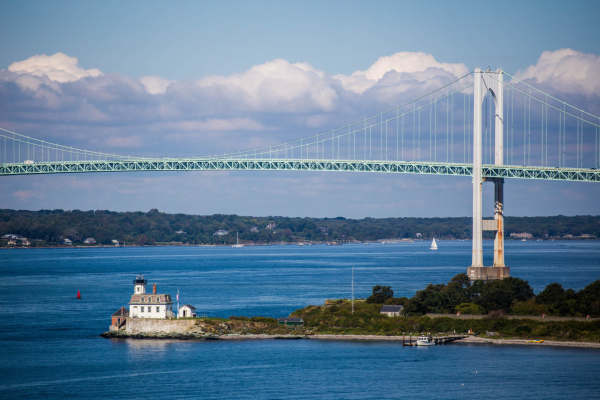 A view of the Rose Island Lighthouse and the Newport Bridge in Rhode Island.