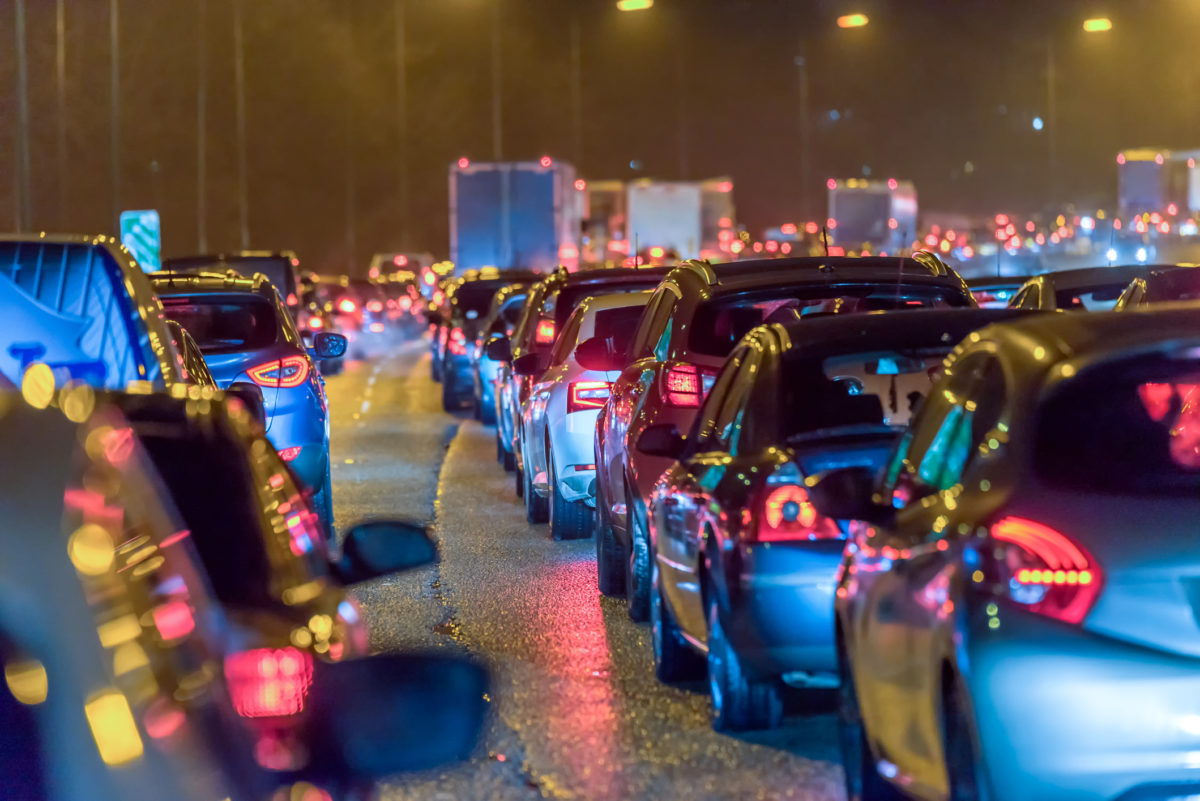 Night view busy UK Motorway traffic jam at night.