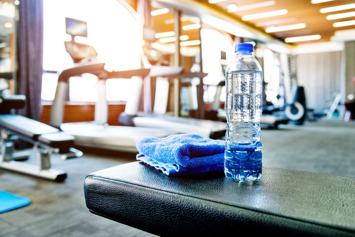 Towel and a bottle of water in gym